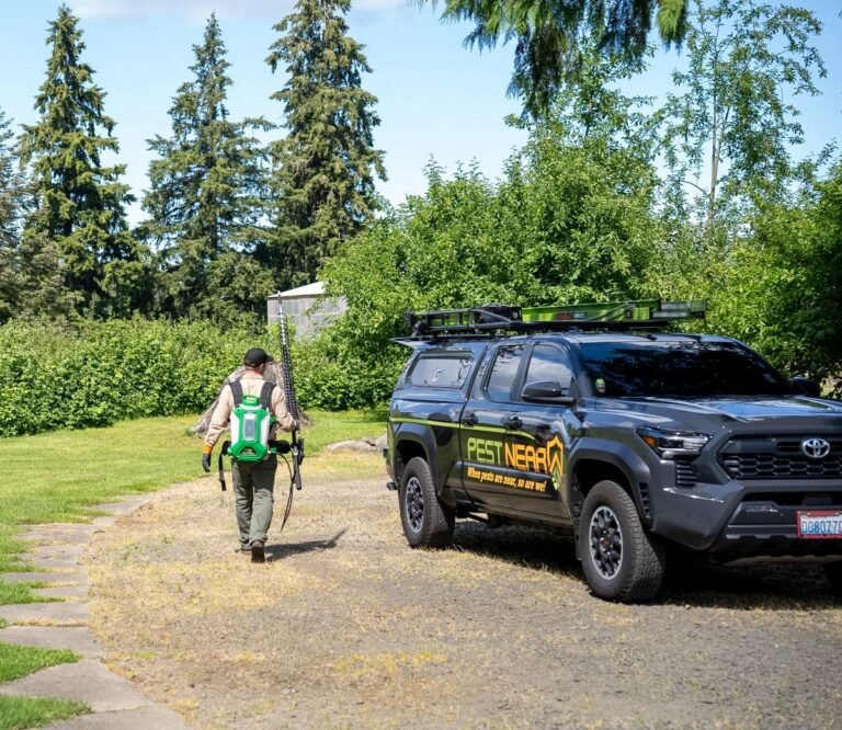 Pest Near technician and branded truck providing pest control service in Everett, WA