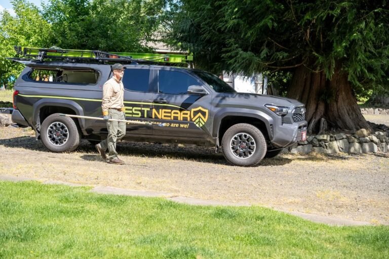 Pest Near technician in front of vehicle